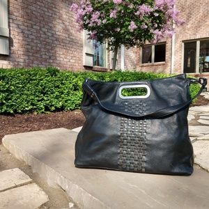 Black Calvin Klein purse with detailed front